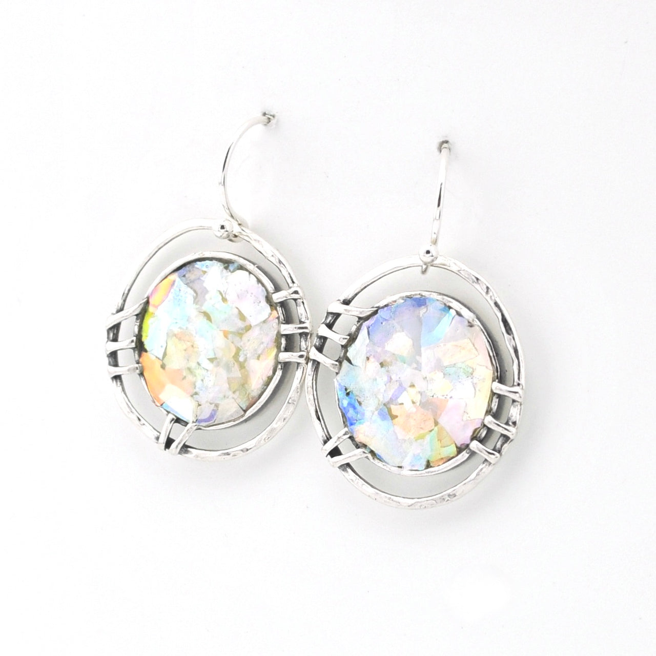 Silver earrings with multicolored glass on a white background