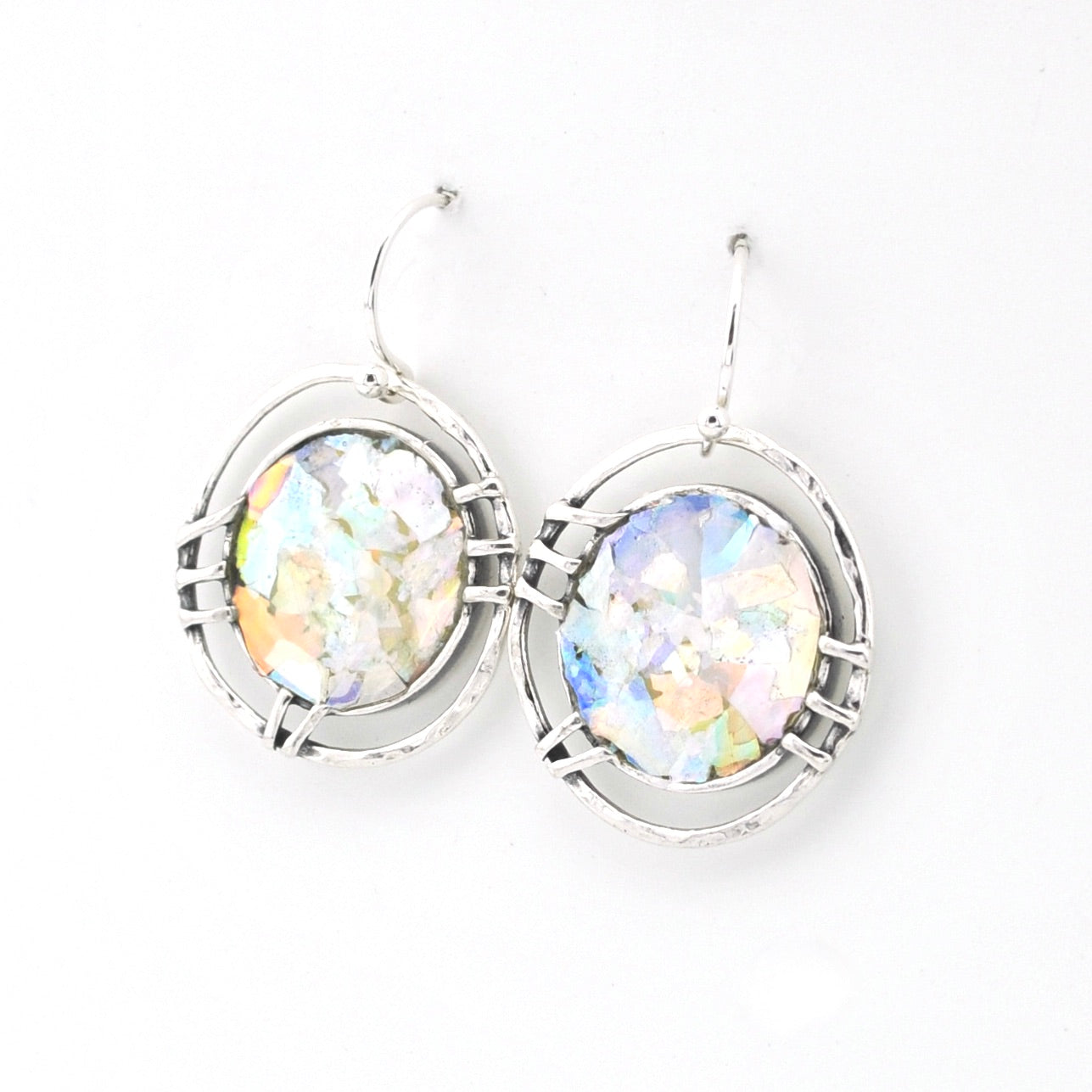 Silver earrings with multicolored glass on a white background