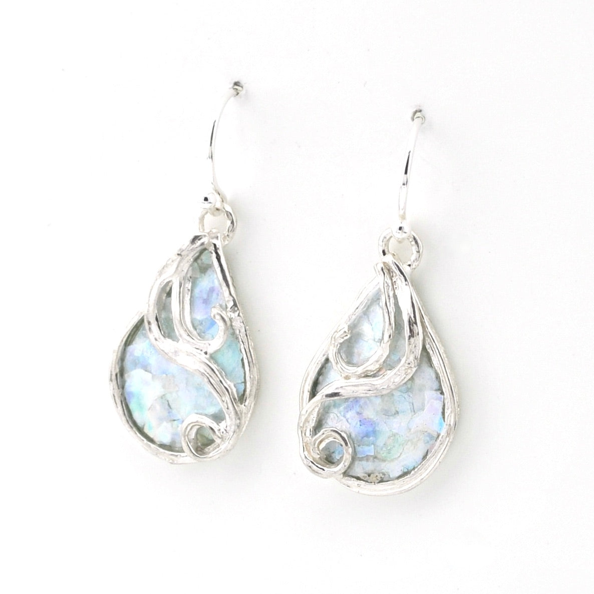 Teardrop-shaped earrings with a light blue Roman glass on a white background
