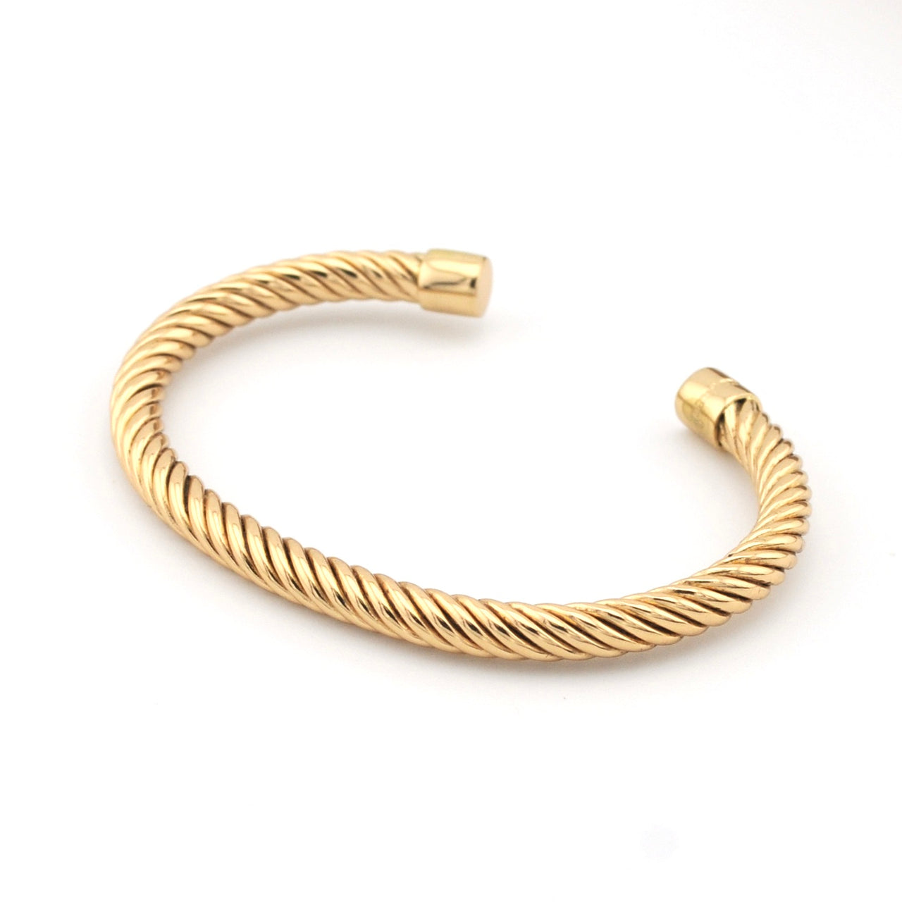 Gold braided bracelet on a white background