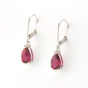 Pair of earrings with pink teardrop-shaped gemstones on a white background