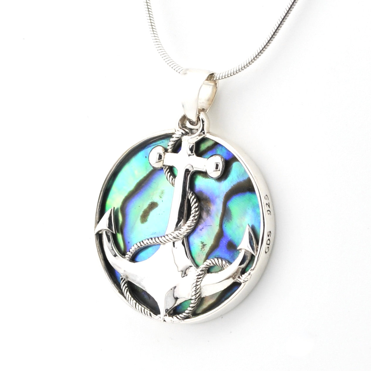Silver pendant with abalone shell design on a white background