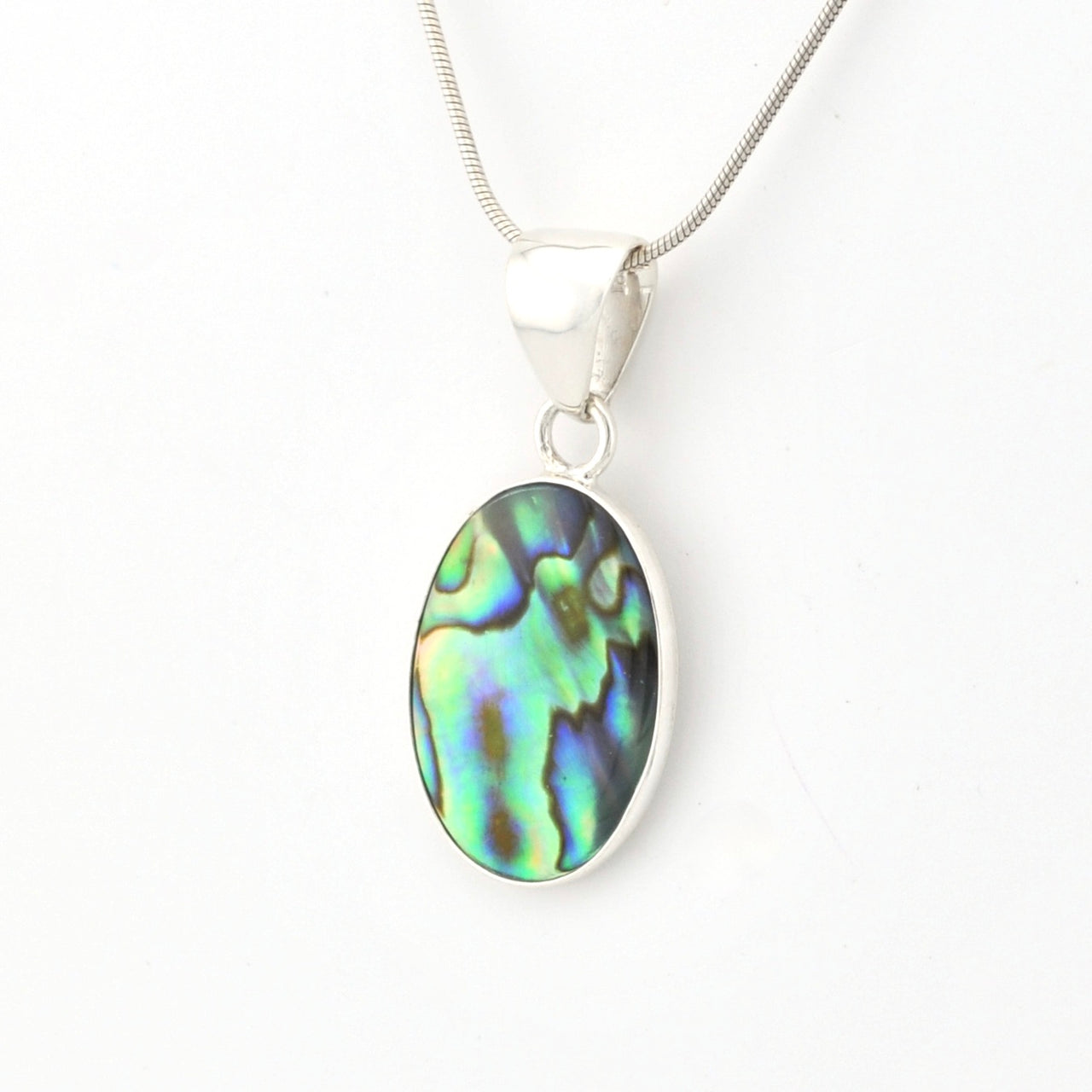 Silver pendant with an abalone shell on a white background