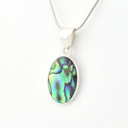 Silver pendant with an abalone shell on a white background