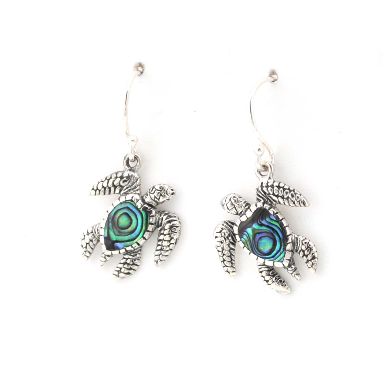 Tortoise-shaped earrings with abalone shell inlays on a white background
