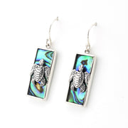 Silver turtle earrings on a white background