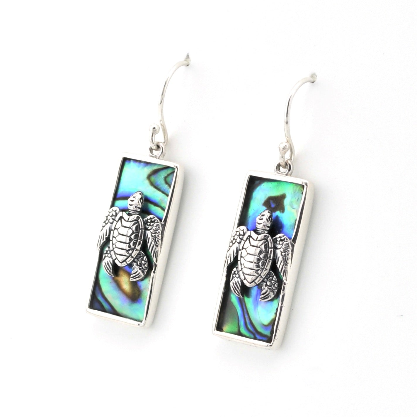 Silver turtle earrings on a white background