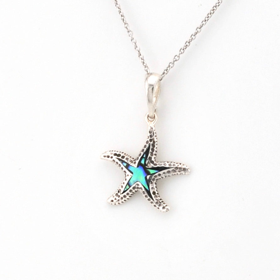 Starfish pendant necklace on a white background