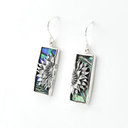 Pair of earrings with floral design on a white background