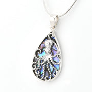 Teardrop-shaped pendant with intricate design on a white background
