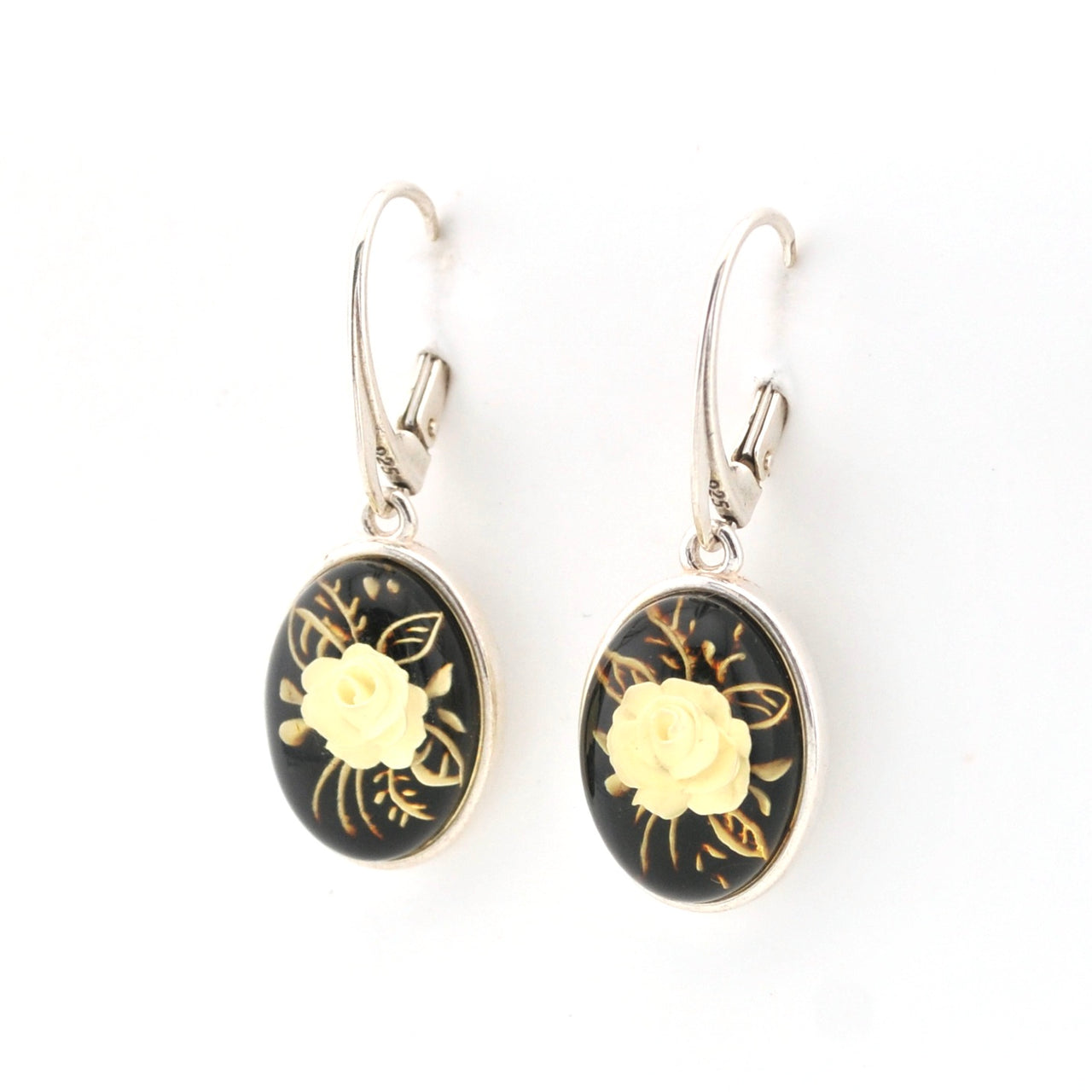 Pair of earrings with floral design on a white background