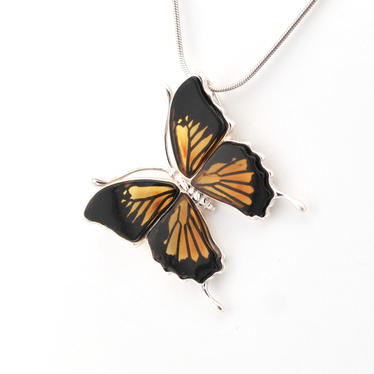 Butterfly-shaped pendant on a white background