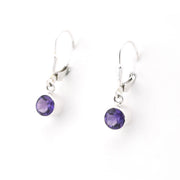 Pair of purple gemstone earrings on a white background