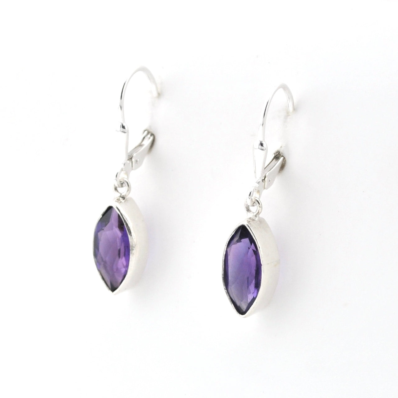 Purple teardrop earrings with silver hooks on a white background