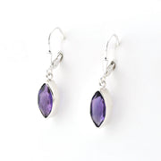 Purple teardrop earrings with silver hooks on a white background