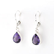 Purple teardrop earrings on a white background