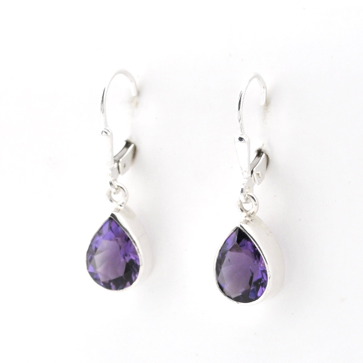 Purple teardrop earrings on a white background