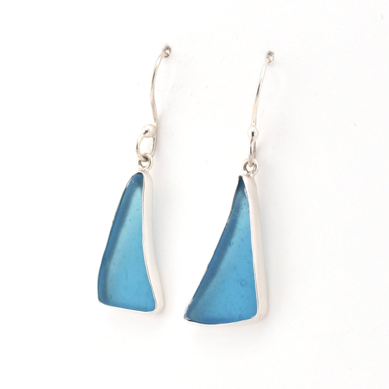 Blue triangular earrings on a white background