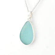 Teardrop-shaped blue pendant on a white background