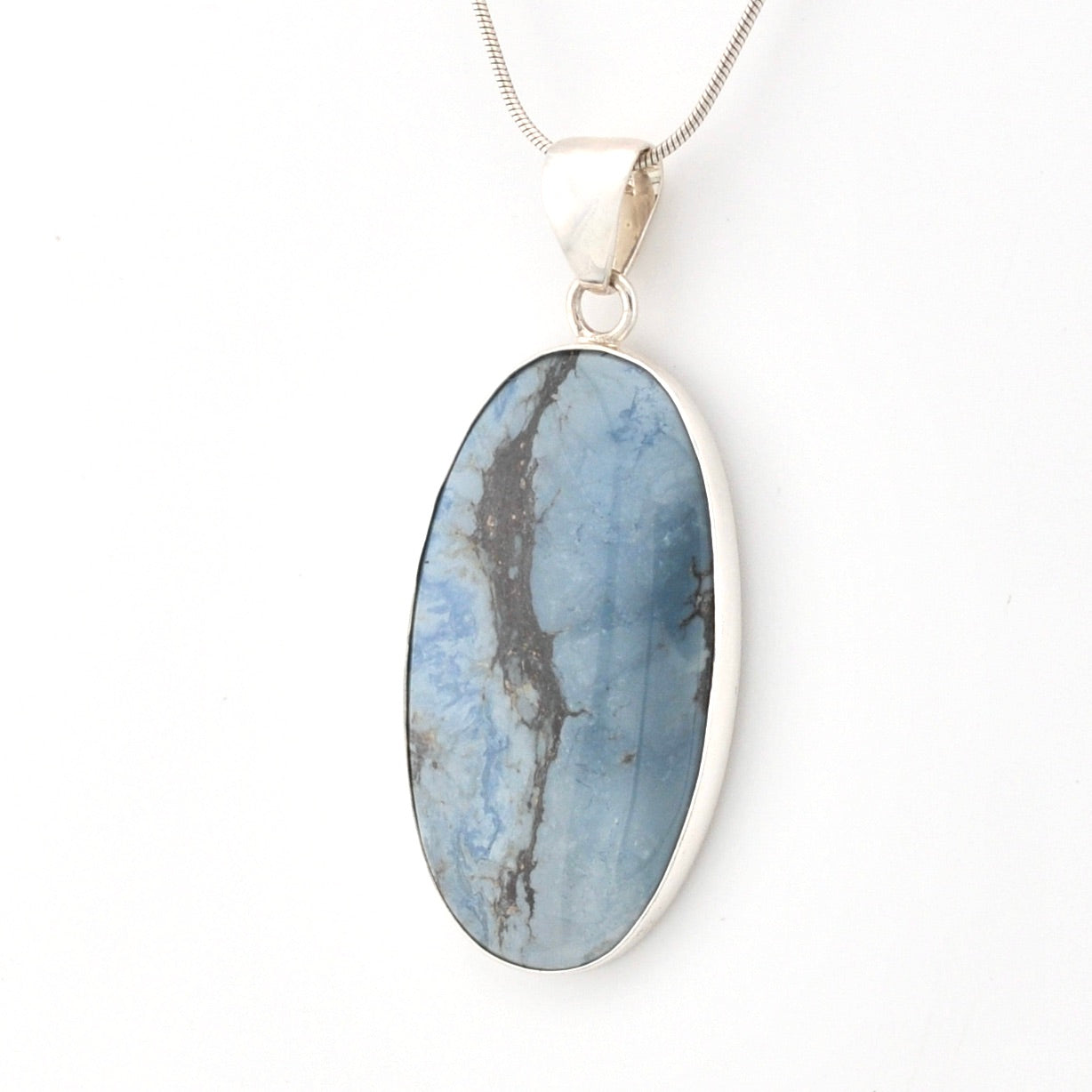Oval-shaped blue stone pendant on a white background