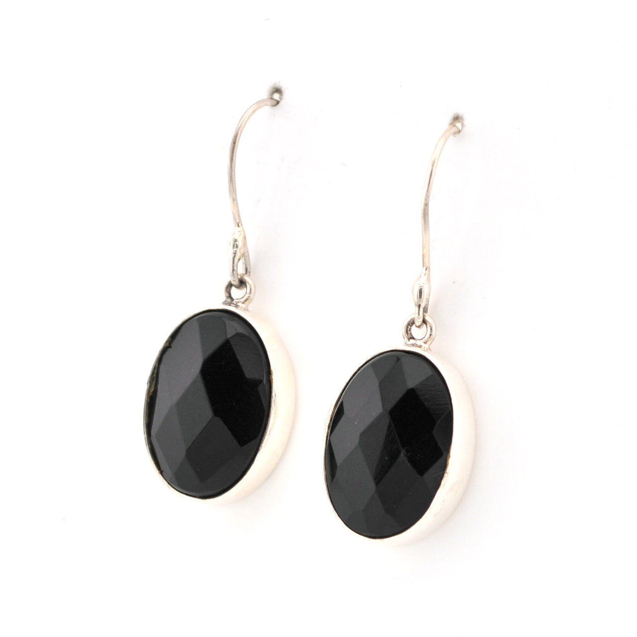 Black oval earrings on silver hooks against a white background