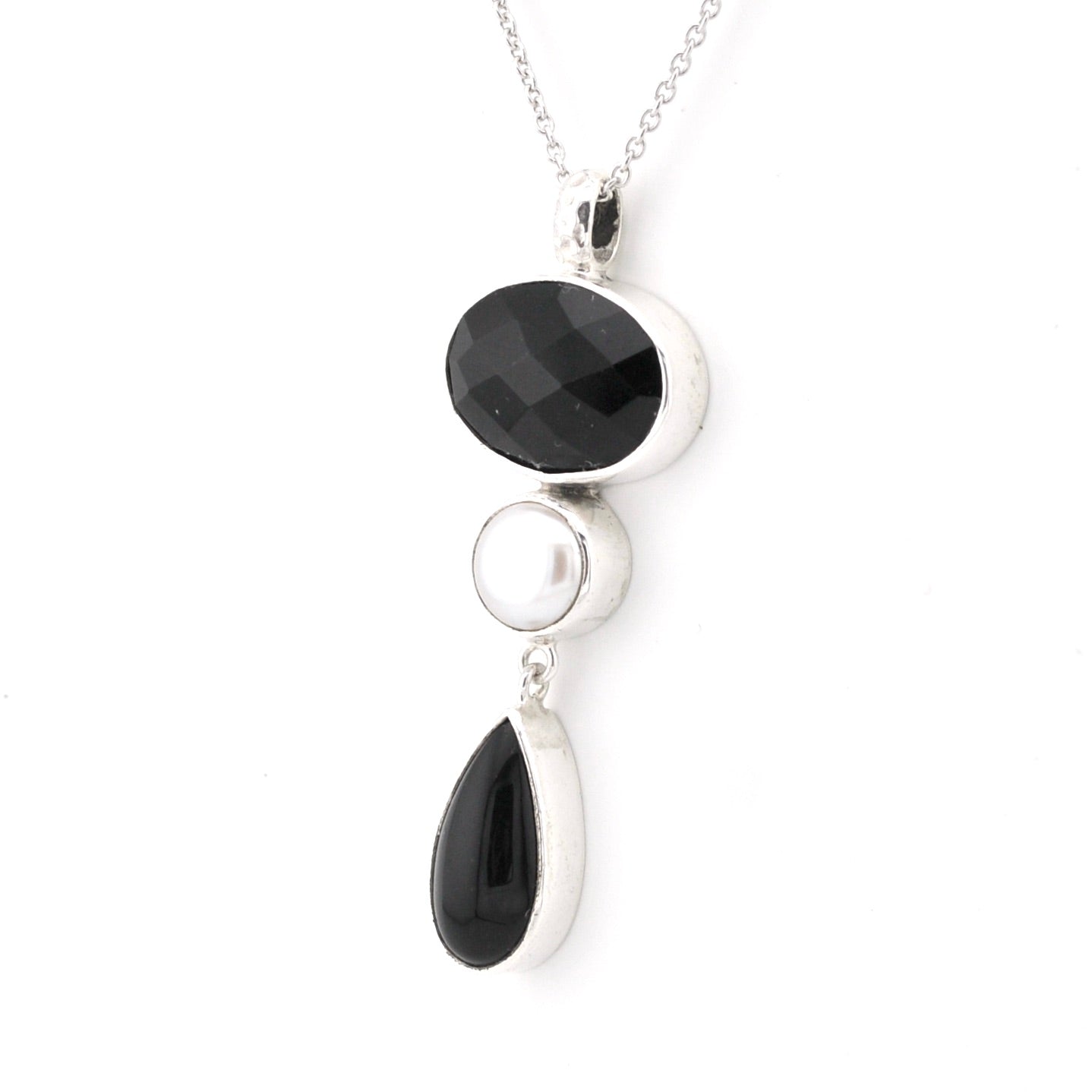 Necklace with black gemstones and silver pendants on a white background