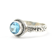 Side View Silver Blue Topaz 7mm Round Bali Scroll Ring