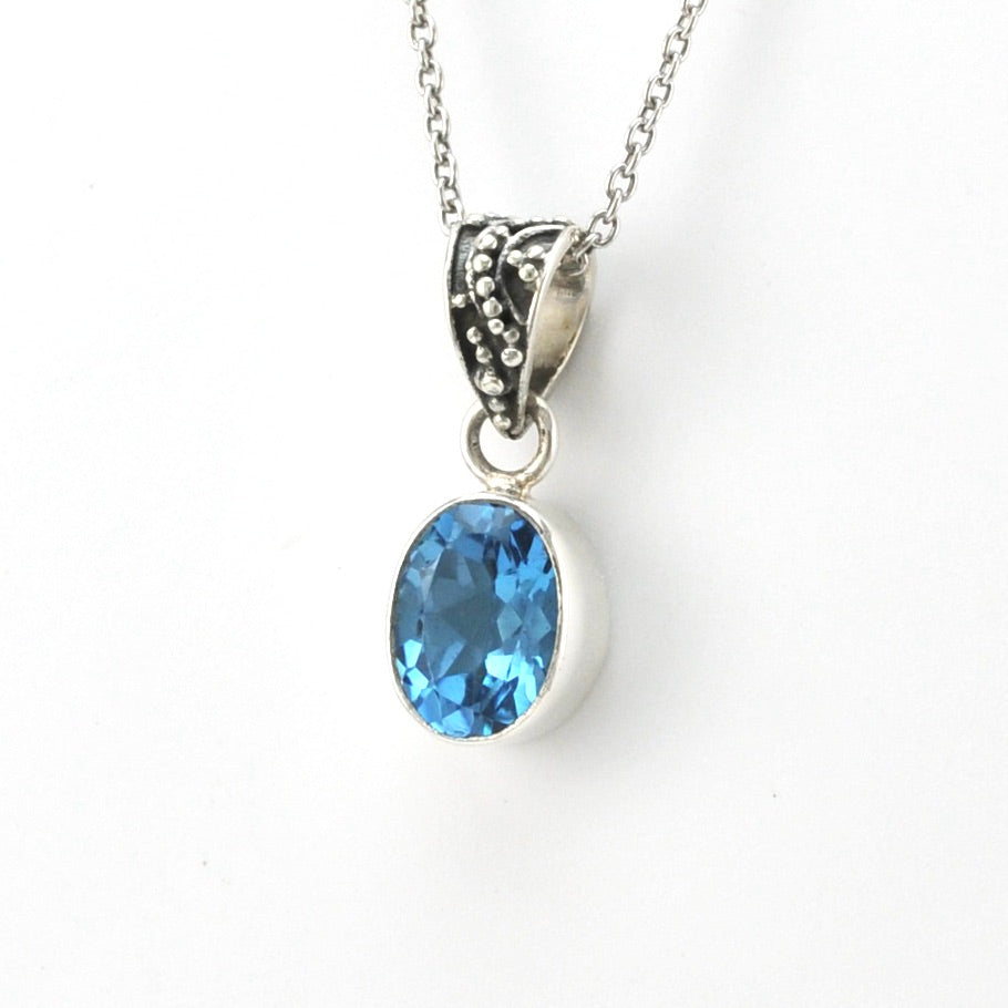 Side View Silver Blue Topaz 7x9mm Oval Bali Bail Necklace