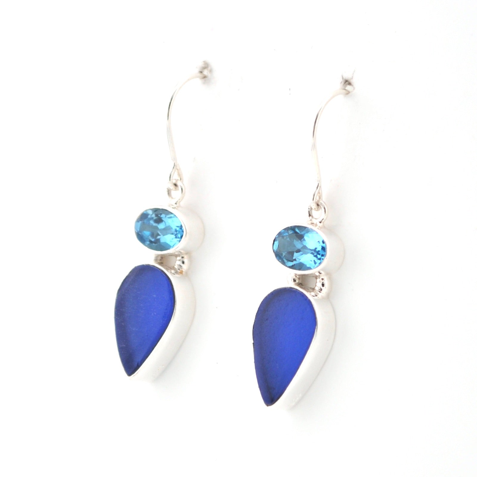 Pair of blue teardrop earrings with gemstones on a white background
