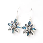 Handmade Sterling Silver Blue Topaz Moonstone Flower Earrings on white background
