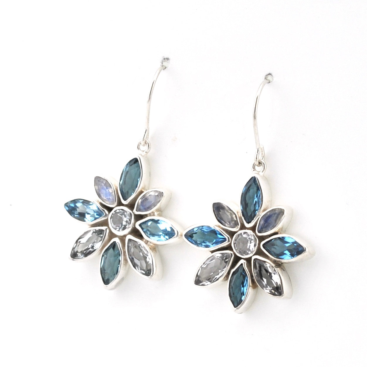 Handmade Sterling Silver Blue Topaz Moonstone Flower Earrings on white background