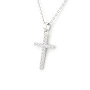 Silver cross necklace on a white background