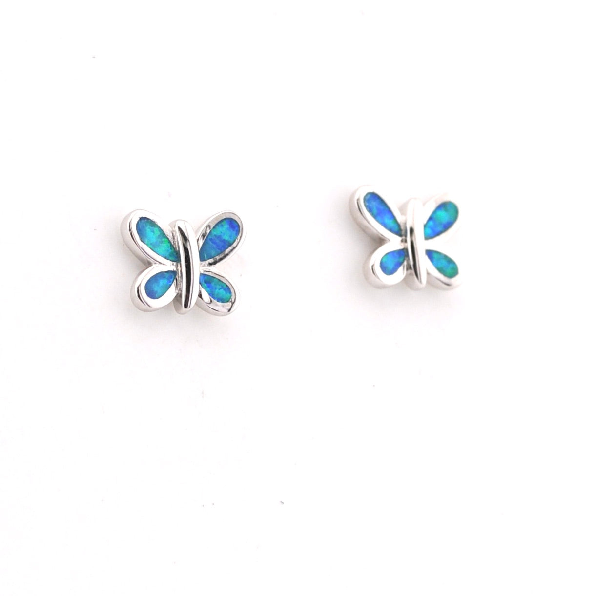 Butterfly-shaped earrings with blue opal inlay on a white background