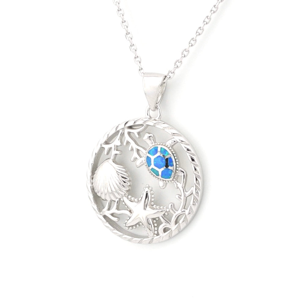 Silver necklace with a round pendant featuring a blue gemstone on a white background