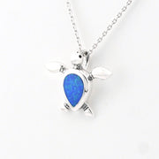 Silver pendant with a blue opal stone on a white background