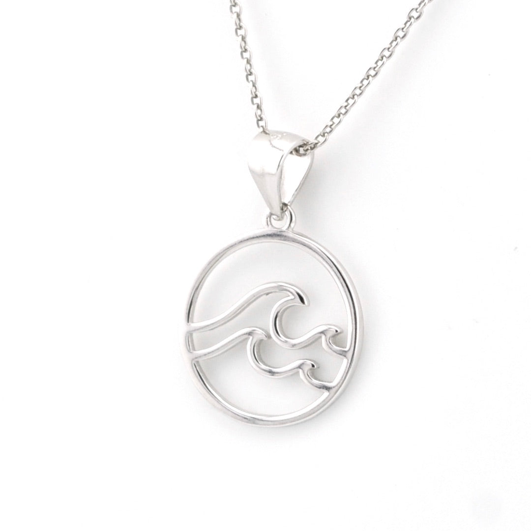 Silver necklace with a wave pendant on a white background