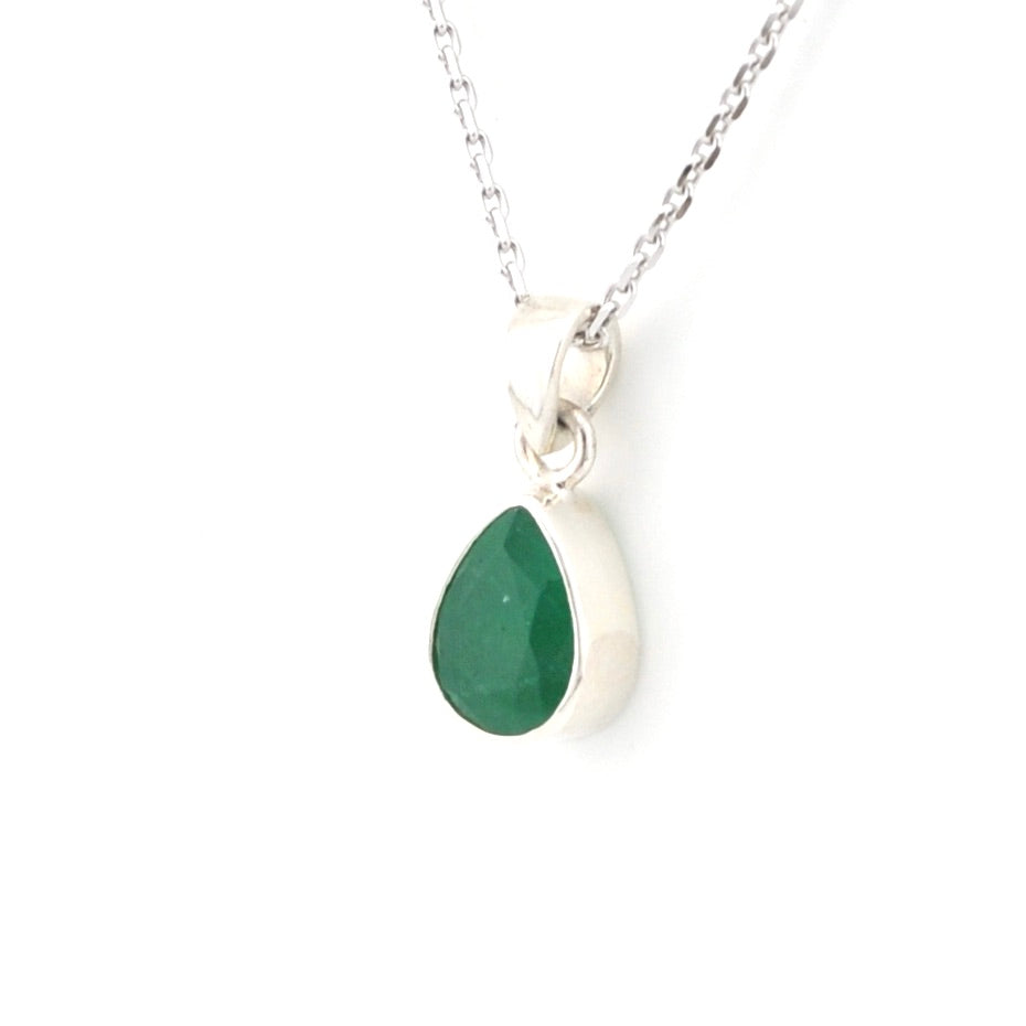 Necklace with a green teardrop pendant on a white background