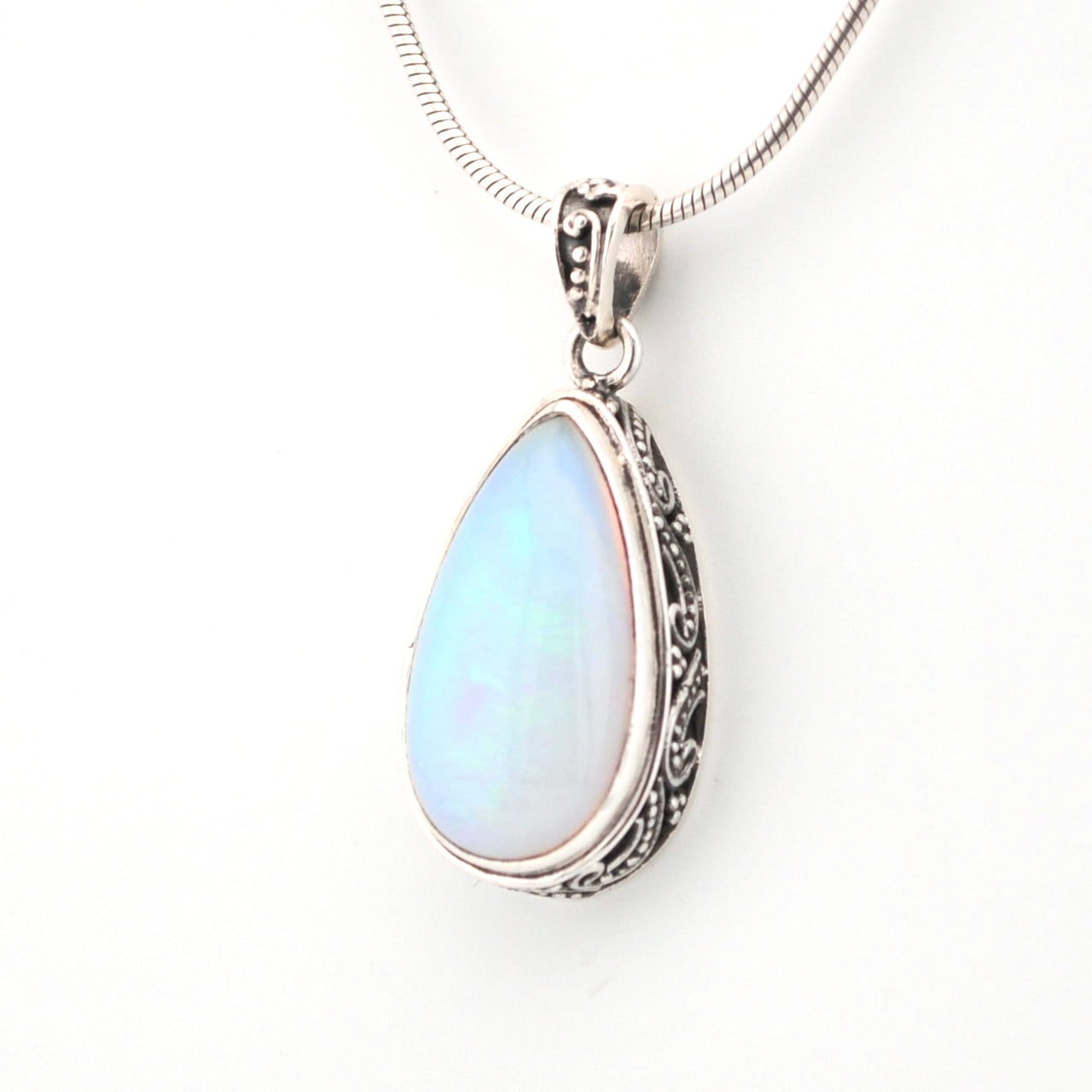 Opal pendant necklace on a white background