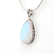 Opal pendant necklace on a white background