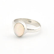 Silver ring with a opal stone on a white background