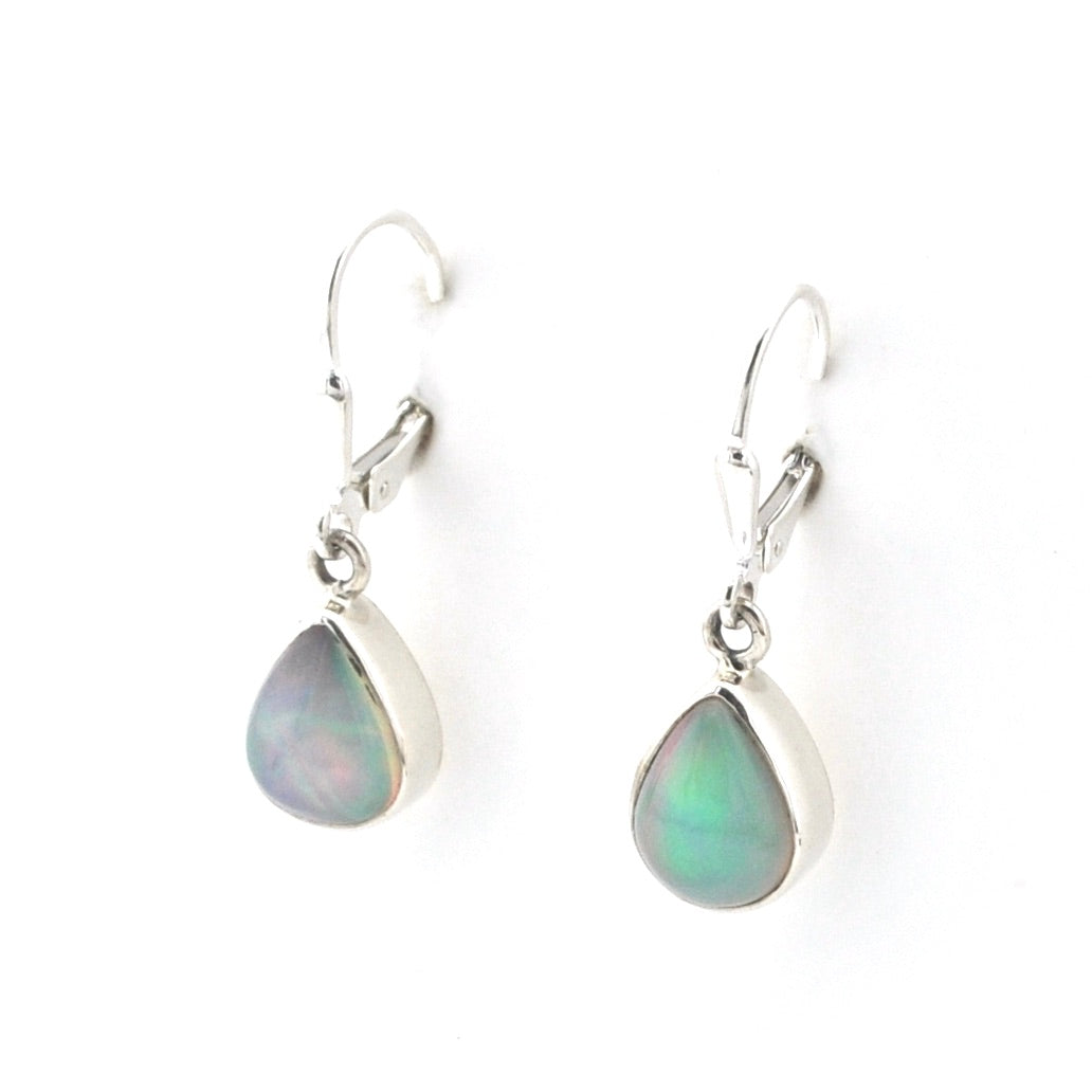 Teardrop-shaped earrings with a metallic finish on a white background