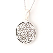 Silver necklace with a round pendant featuring a geometric pattern on a white background