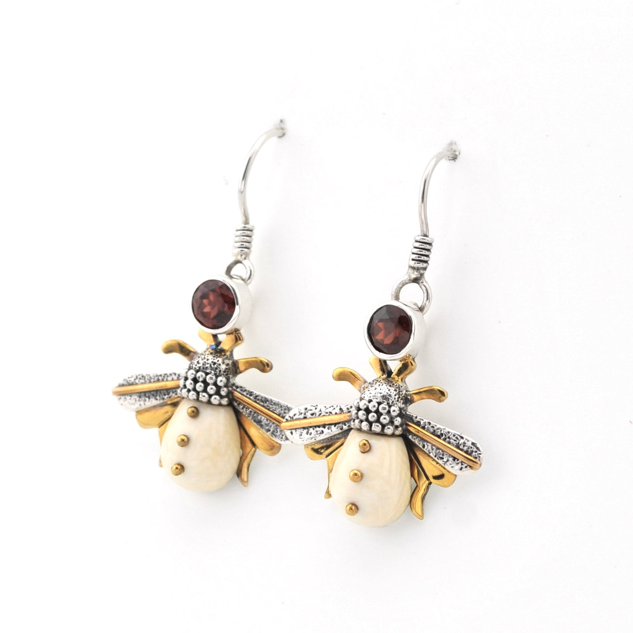 Bee-shaped earrings with gold and silver details on a white background