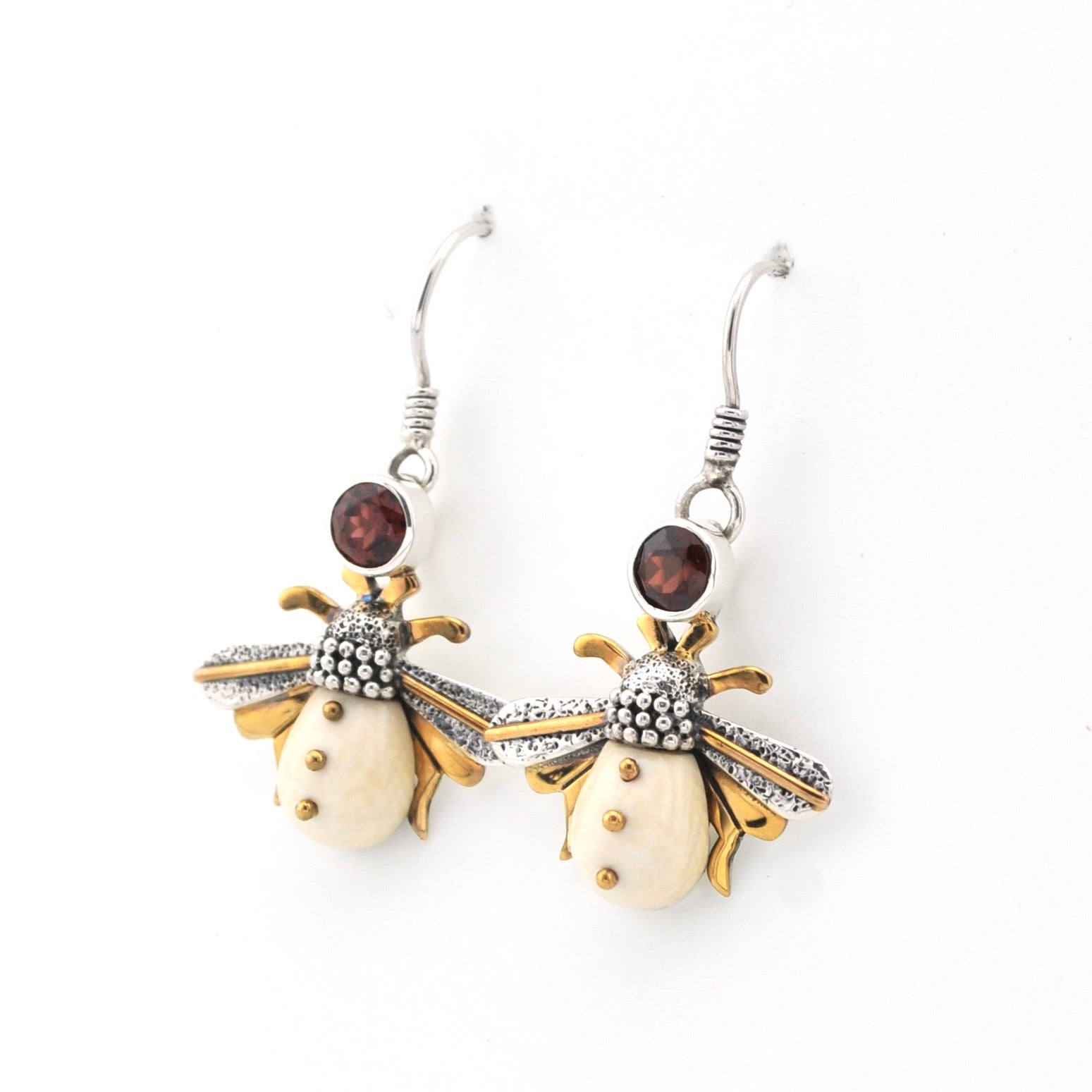 Bee-shaped earrings with gold and silver details on a white background