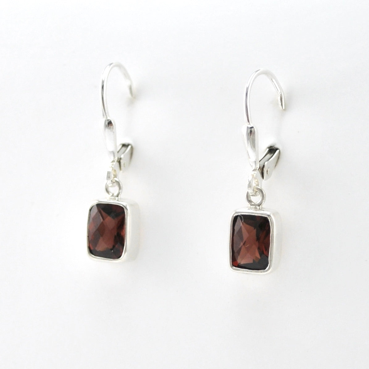 Side View Silver Garnet 5x7mm Rectangular Dangle Earrings