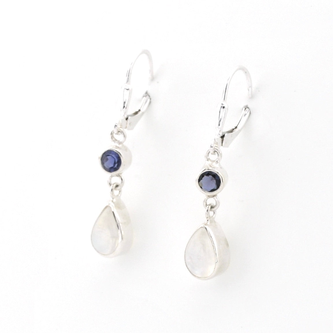 Pair of silver earrings with teardrop-shaped stones on a white background