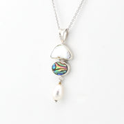 Necklace with a pendant featuring a colorful gemstone and pearl on a white background