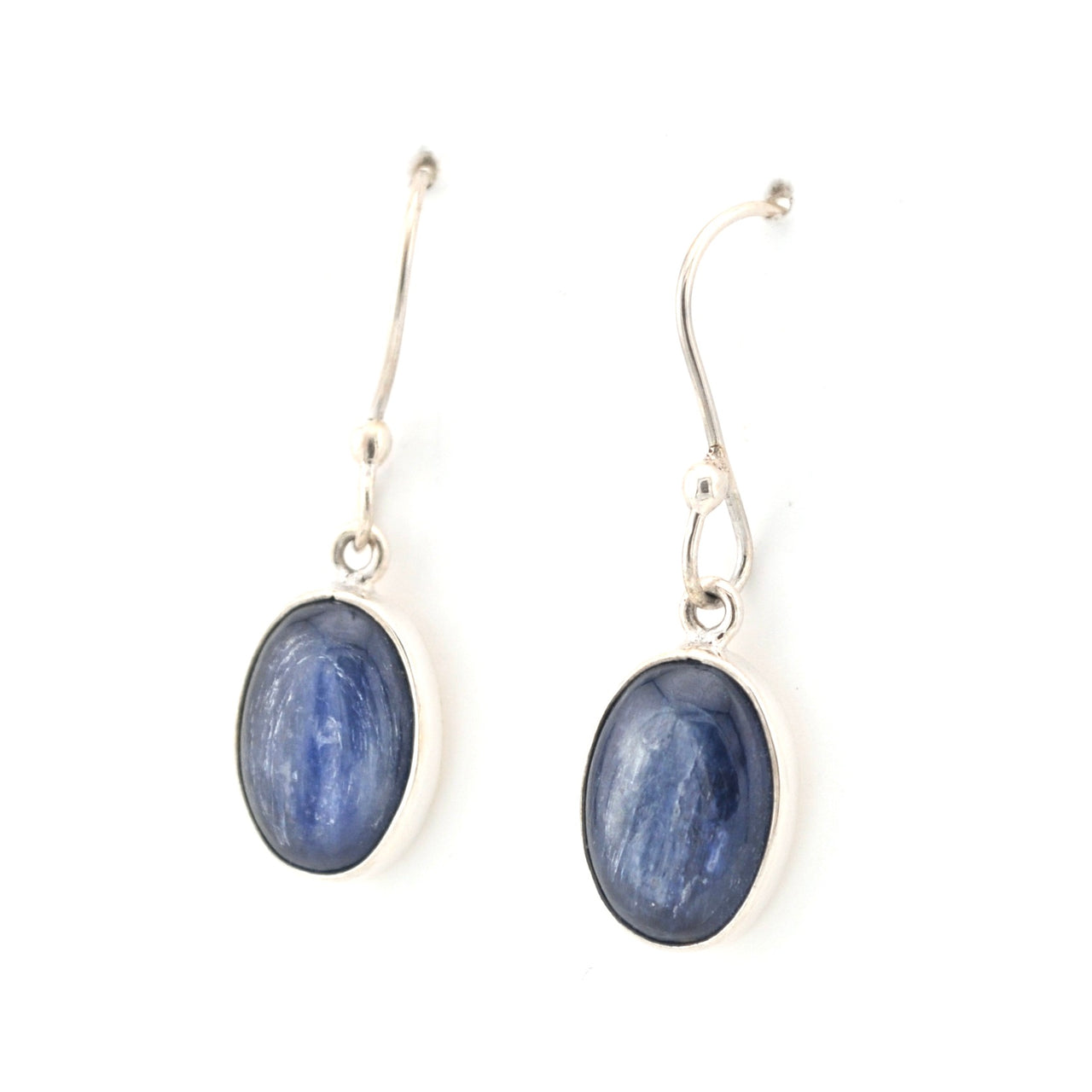 Pair of blue oval stone earrings on silver hooks against a white background