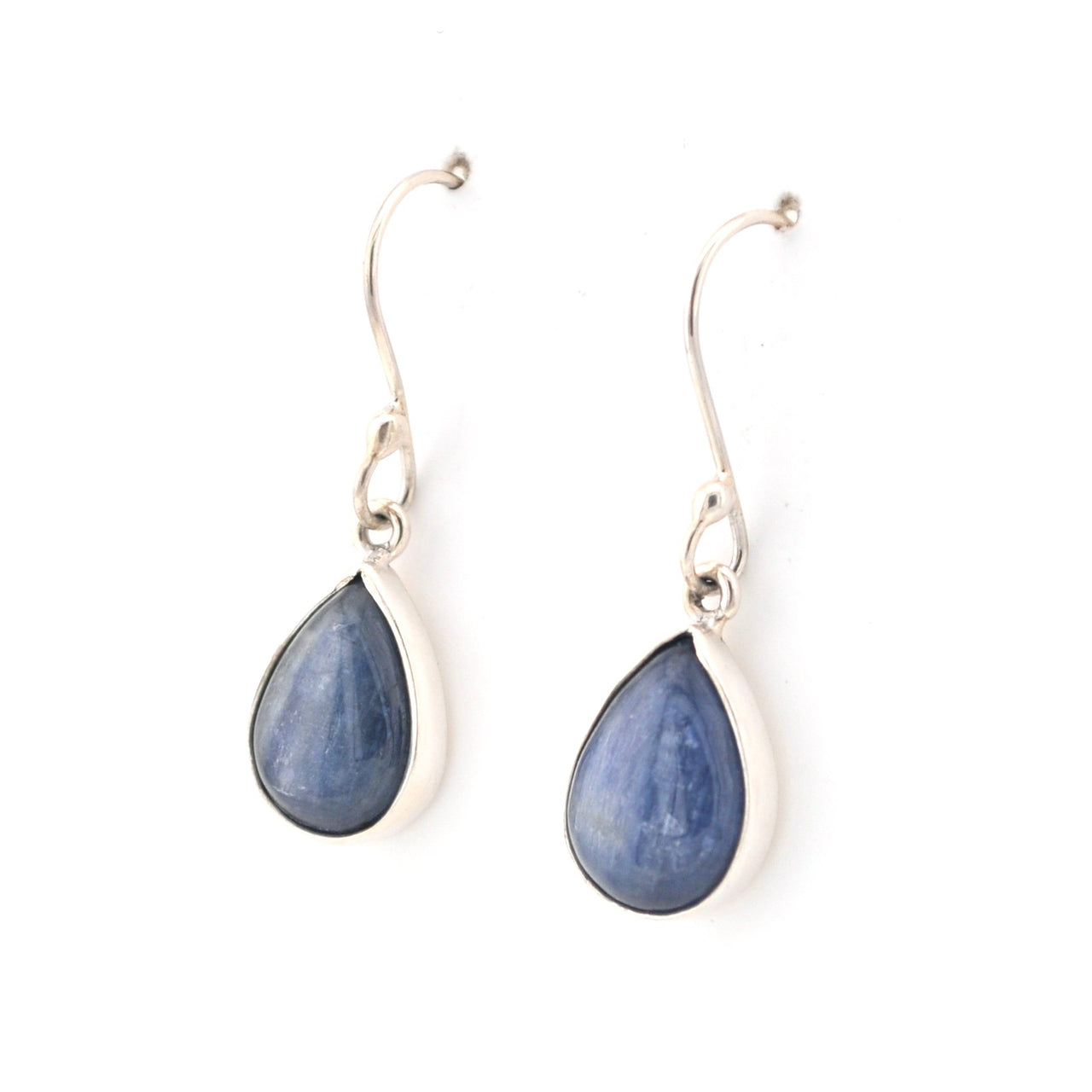 Pair of silver teardrop earrings with blue stones on a white background