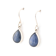 Pair of silver teardrop earrings with blue stones on a white background